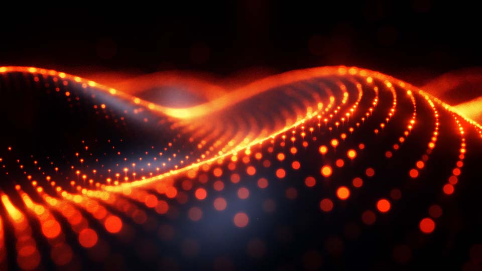 A glowing orange and black background with wave patterns