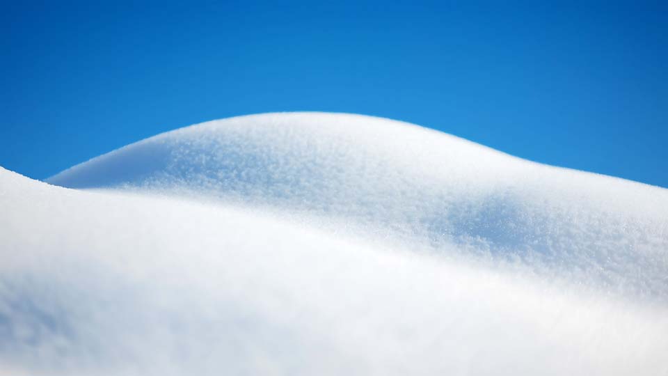 A large snow-covered hill