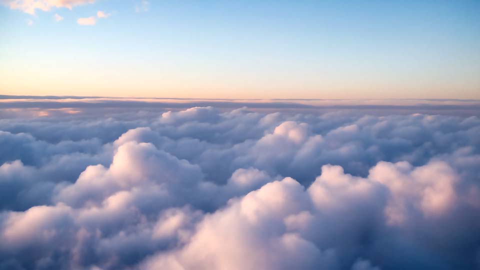 Aerial view of the sky with clouds at dawn