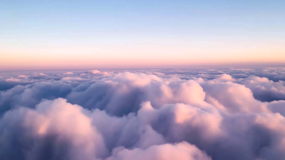 Aerial view of the sky with clouds at dawn