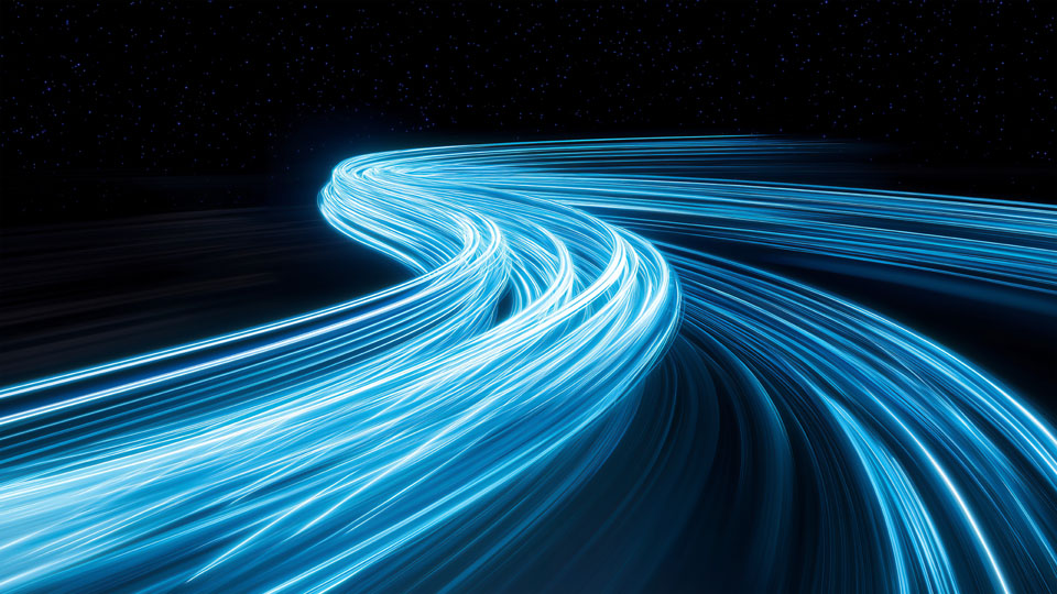 Blue glowing light trails in space