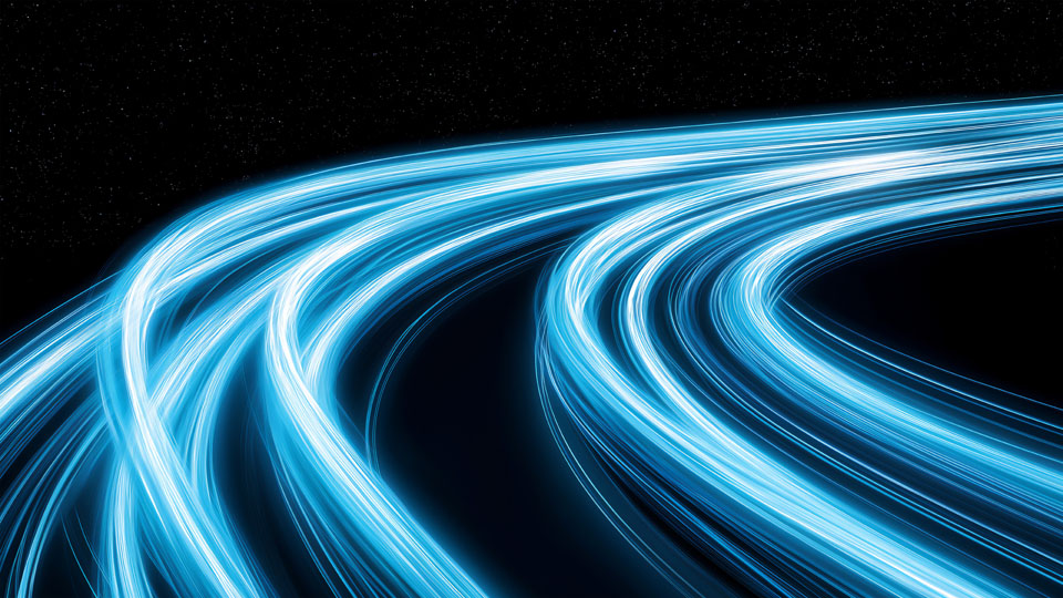 Blue glowing light trails in space