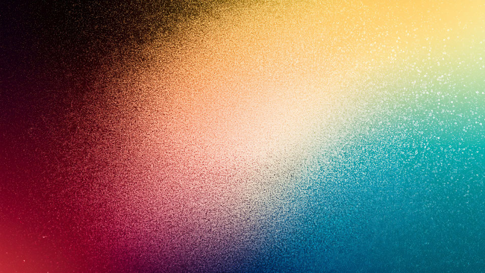 Colorful gradient rainbow background with a grainy texture