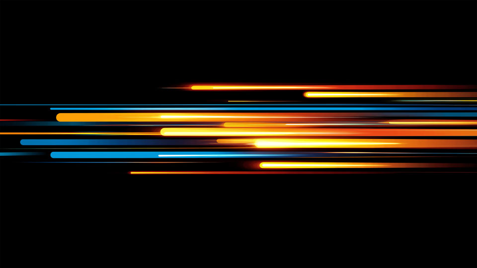 Orange and blue light streaks on a black background