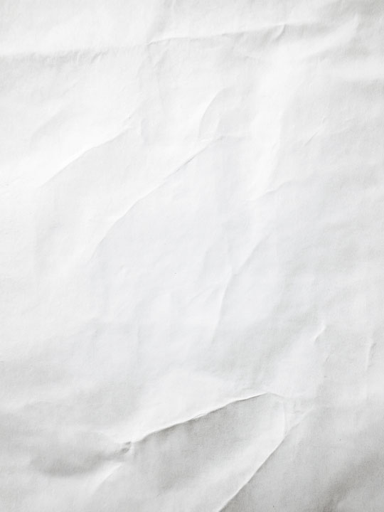 Crumpled paper texture with soft lighting