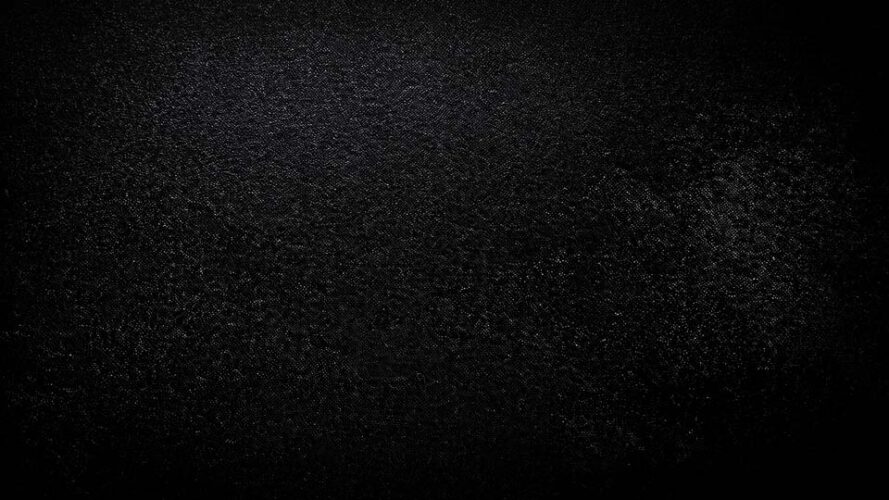 Black background with a grainy overlay texture