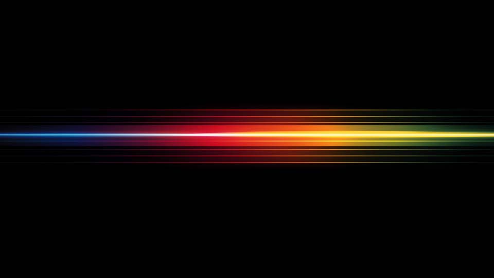 Horizontal rainbow-colored light streak on a black background