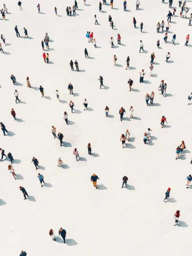 Crowd walking on a white floor