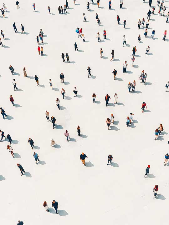 Crowd walking on a white floor