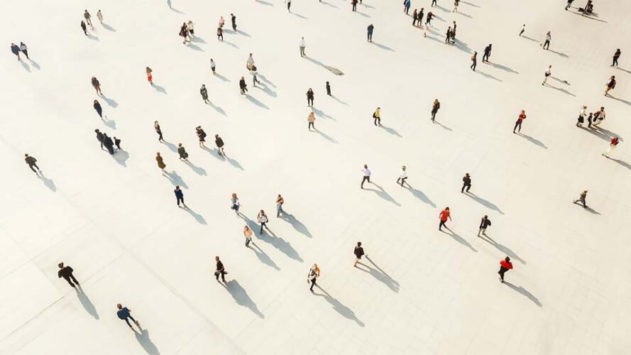 Crowd walking on a white floor