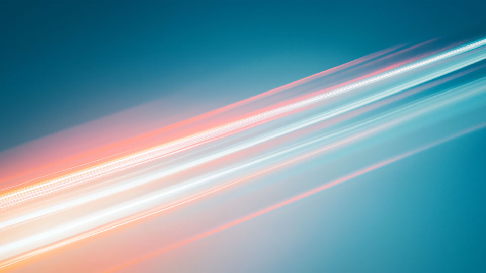 Blurred streak of light against the blue sky