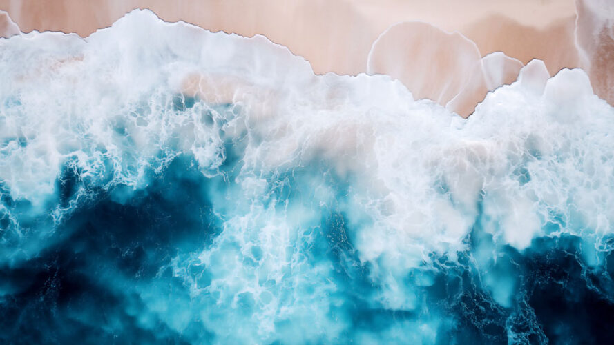 Ocean waves against a sandy beach