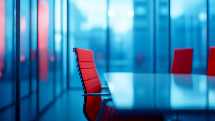 Red office chairs in a boardroom