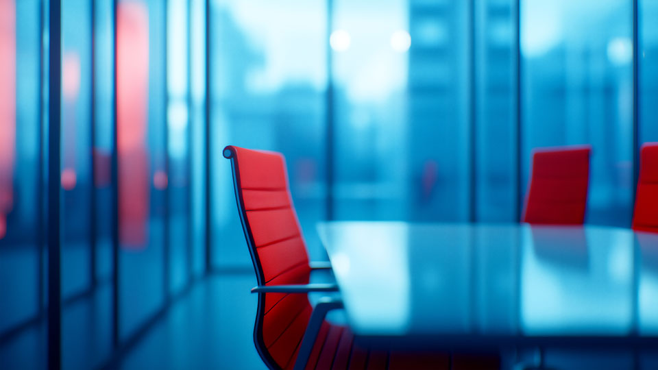 Red office chairs in a boardroom