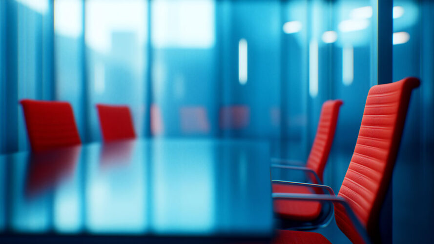 Red office chairs in a boardroom