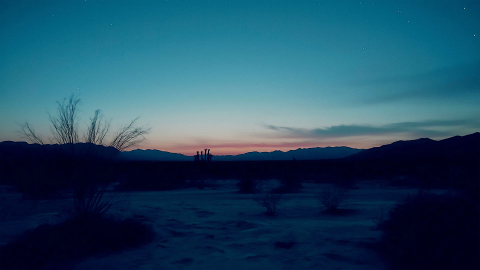 Desert at night with mountains