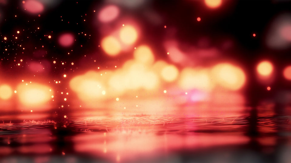 Pink and red reflections on a street in the rain