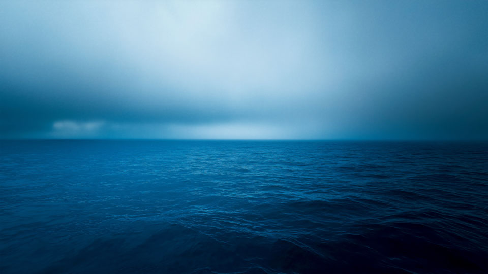Dark blue ocean horizon at night
