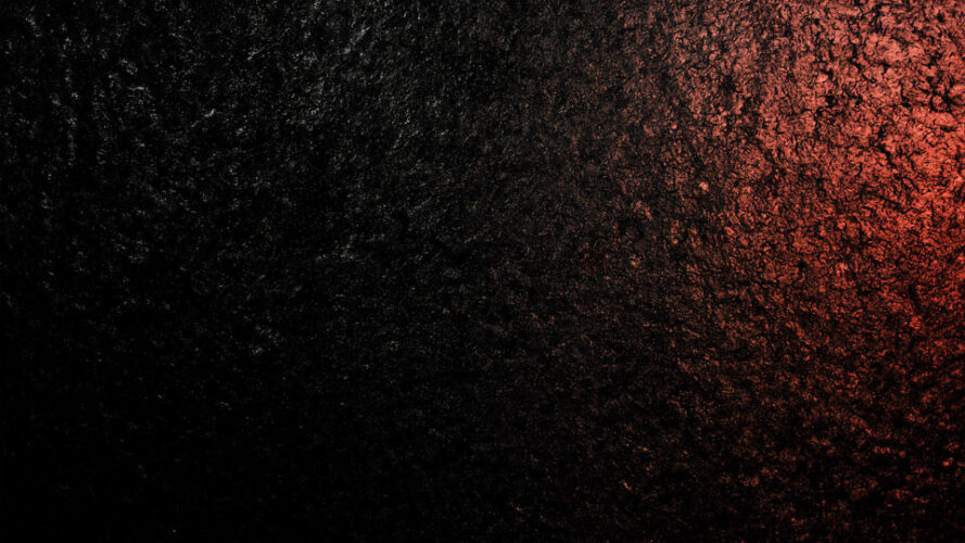 Black background with rose gold powder particles