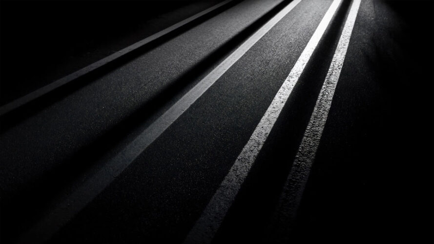 Close-up of asphalt with white stripes