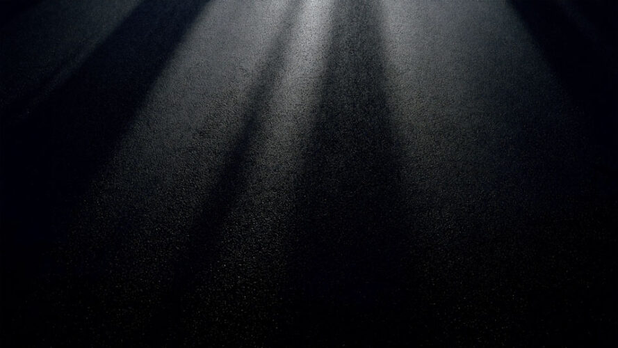 Abstract asphalt backdrop with dramatic lighting