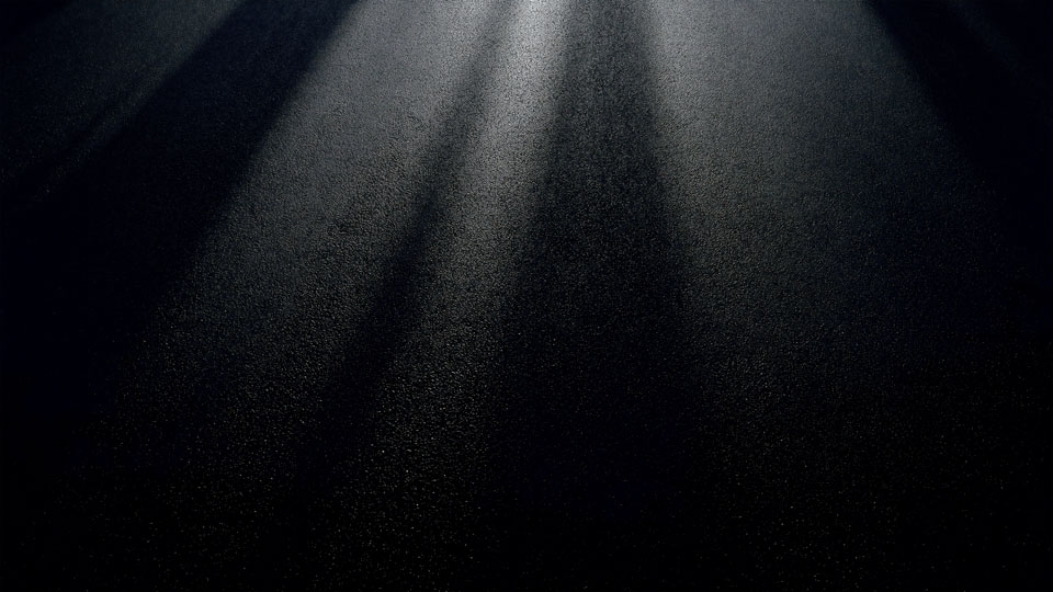 Abstract asphalt backdrop with dramatic lighting