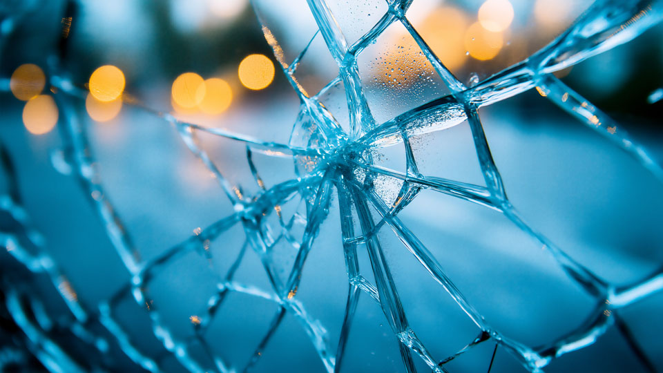 Cracked window macro with urban atmosphere